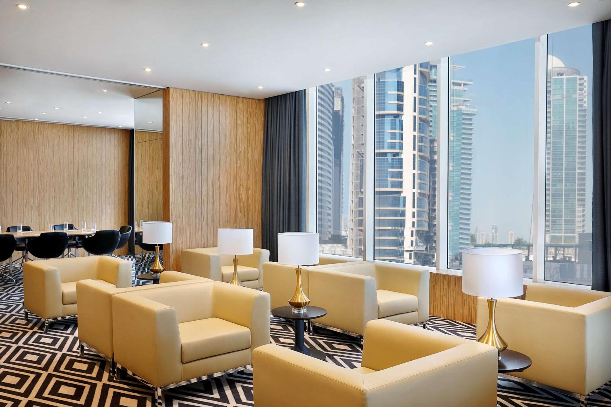 الشقق الفندقية ألِف الدوحة ريزيدنسز مجموعة كوريو من هيلتون المظهر الخارجي الصورة The lounge at the airport