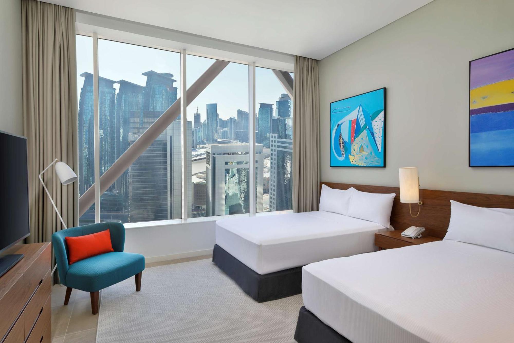 الشقق الفندقية ألِف الدوحة ريزيدنسز مجموعة كوريو من هيلتون المظهر الخارجي الصورة A guest room at the hotel