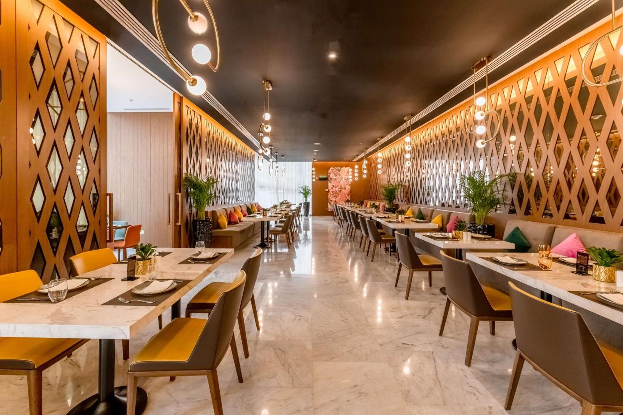 الشقق الفندقية ألِف الدوحة ريزيدنسز مجموعة كوريو من هيلتون المظهر الخارجي الصورة The interior of the restaurant
