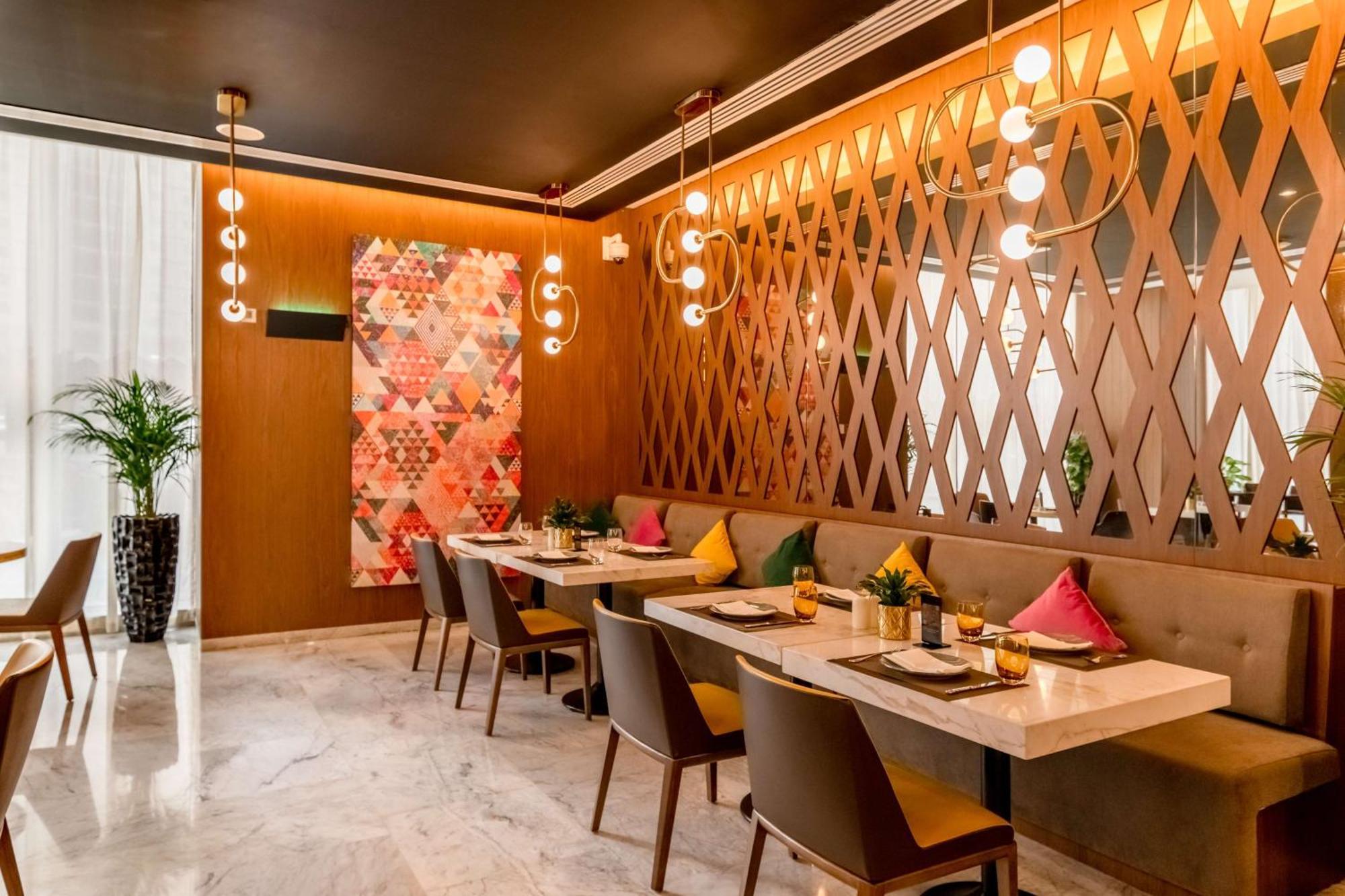 الشقق الفندقية ألِف الدوحة ريزيدنسز مجموعة كوريو من هيلتون المظهر الخارجي الصورة The interior of the restaurant